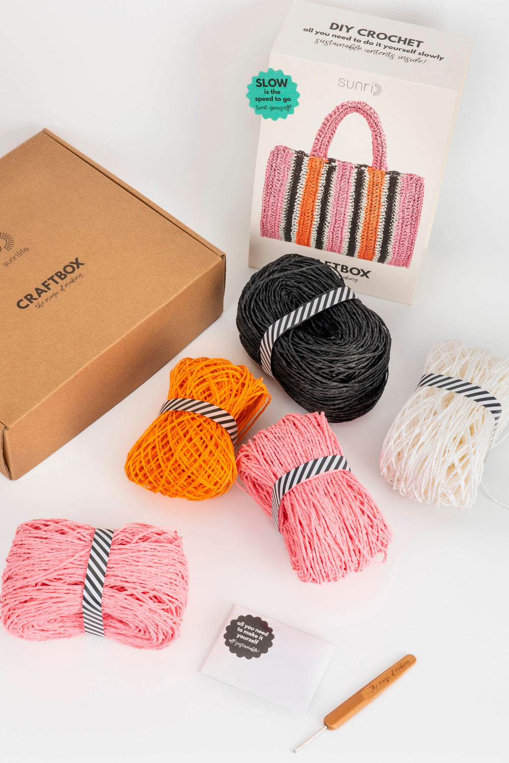 Craftbox DIY crochet kit with yarn and a crochet hook on a white background