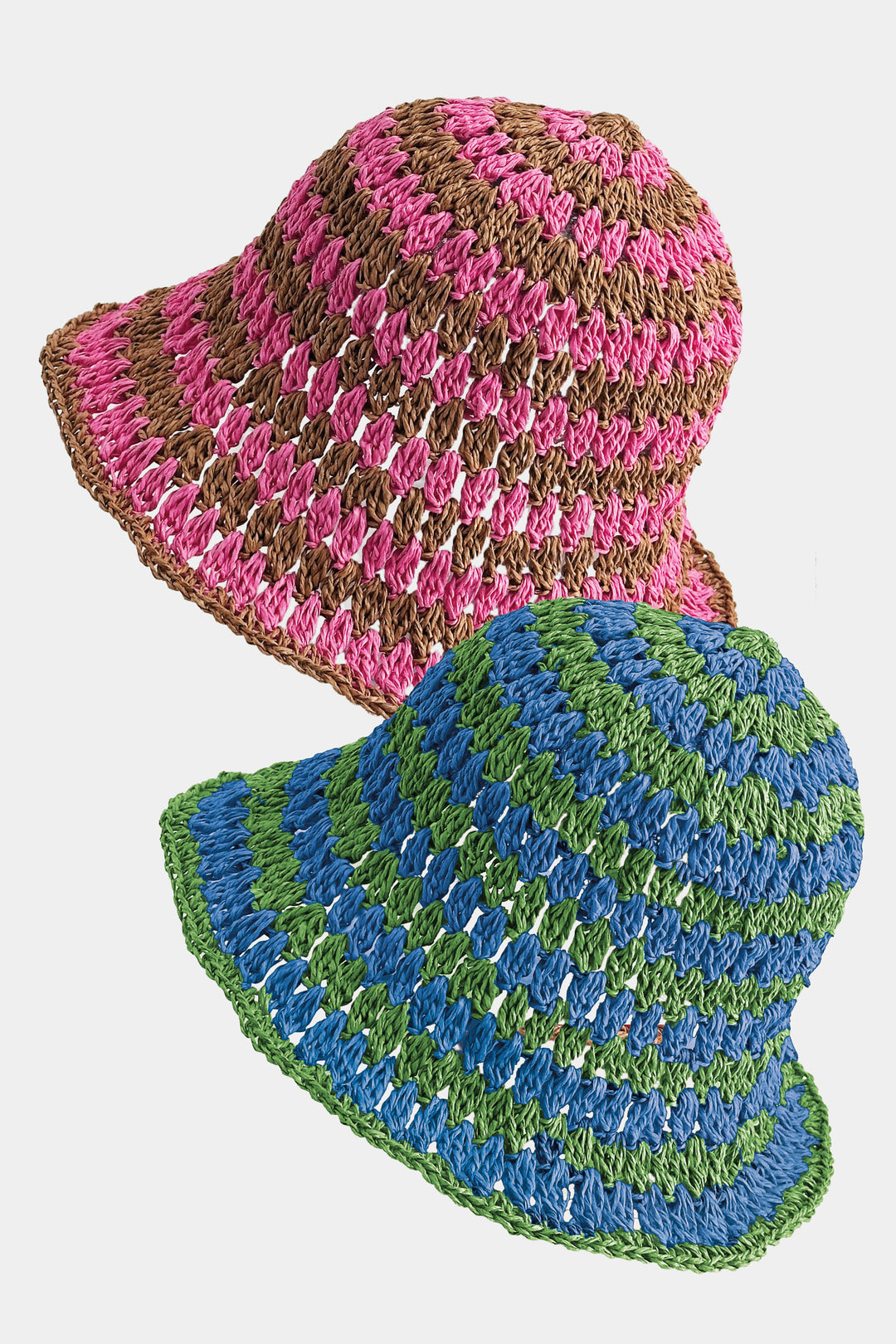 Two striped bucket hats, one pink and brown, the other blue and green, on a white background.