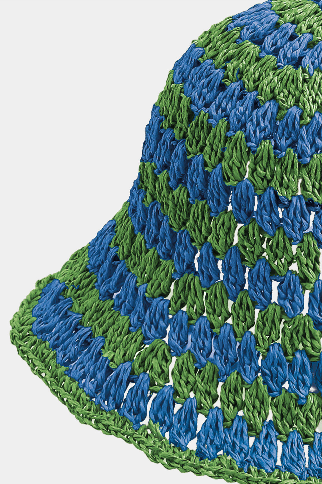 Close-up of a green and blue textured fabric on a white background