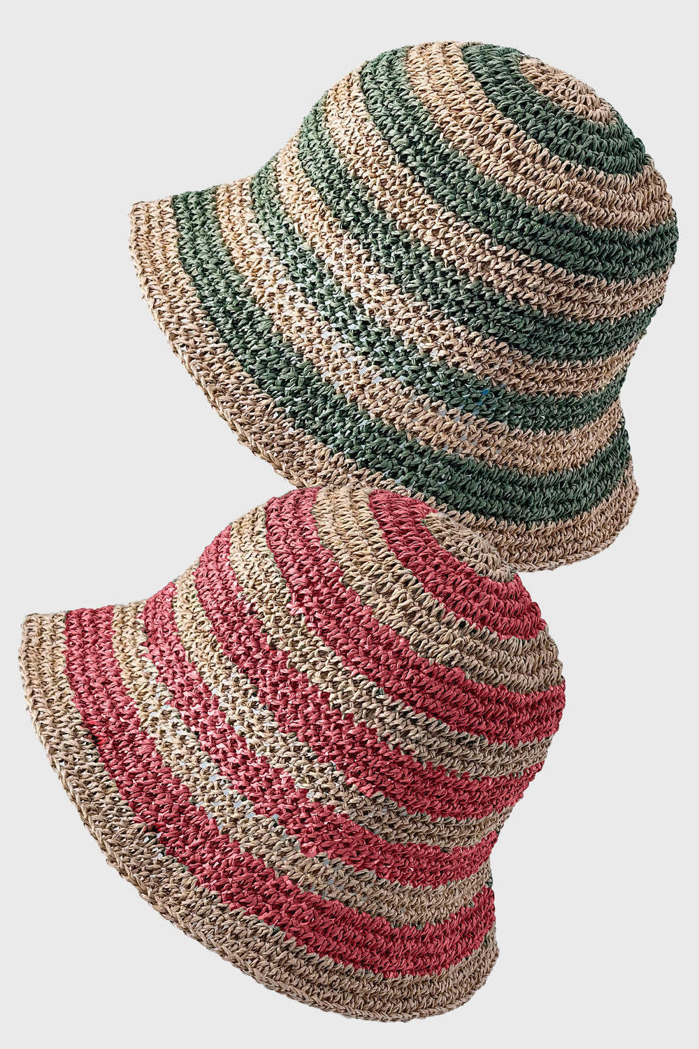 Striped straw hat with green, pink, and beige colors on a white background