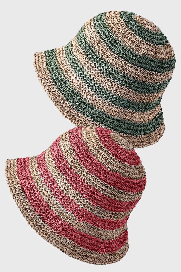 Striped straw hat with green, pink, and beige colors on a white background