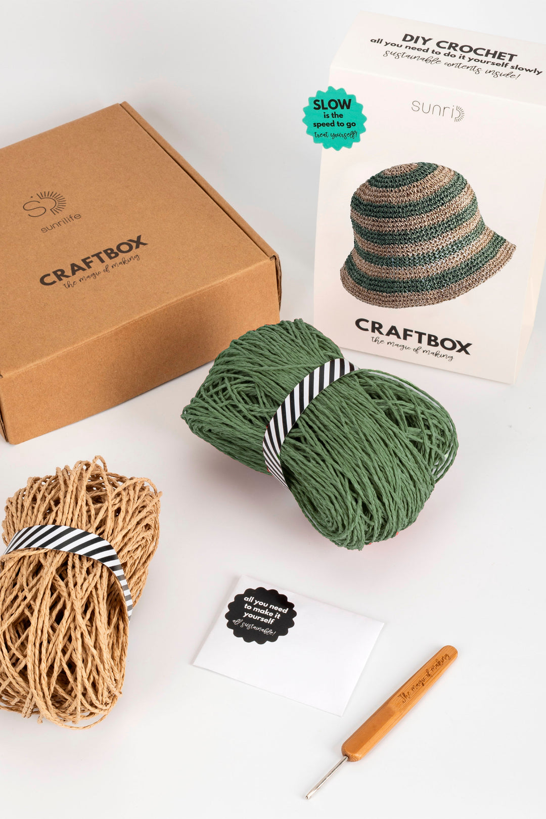 Craftbox crochet kit with yarn, hook, and pattern on a white background