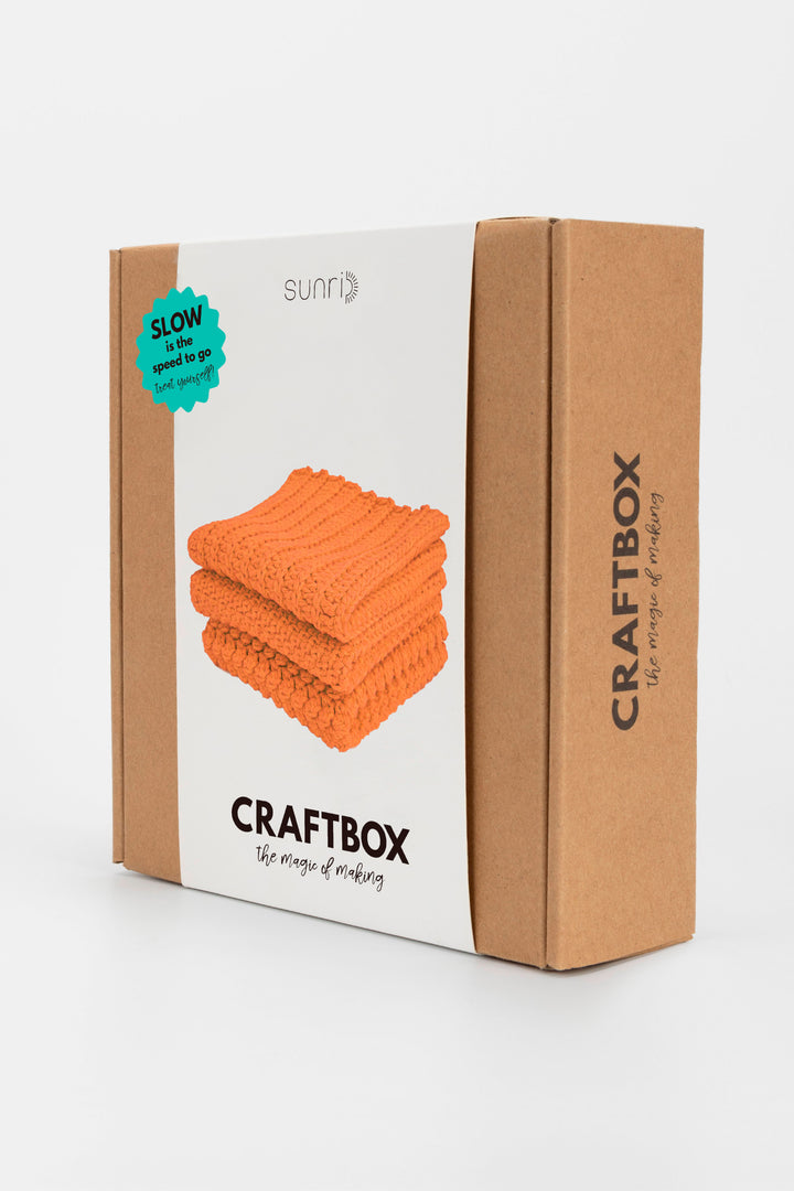 Craftbox packaging with orange fabric on a white background