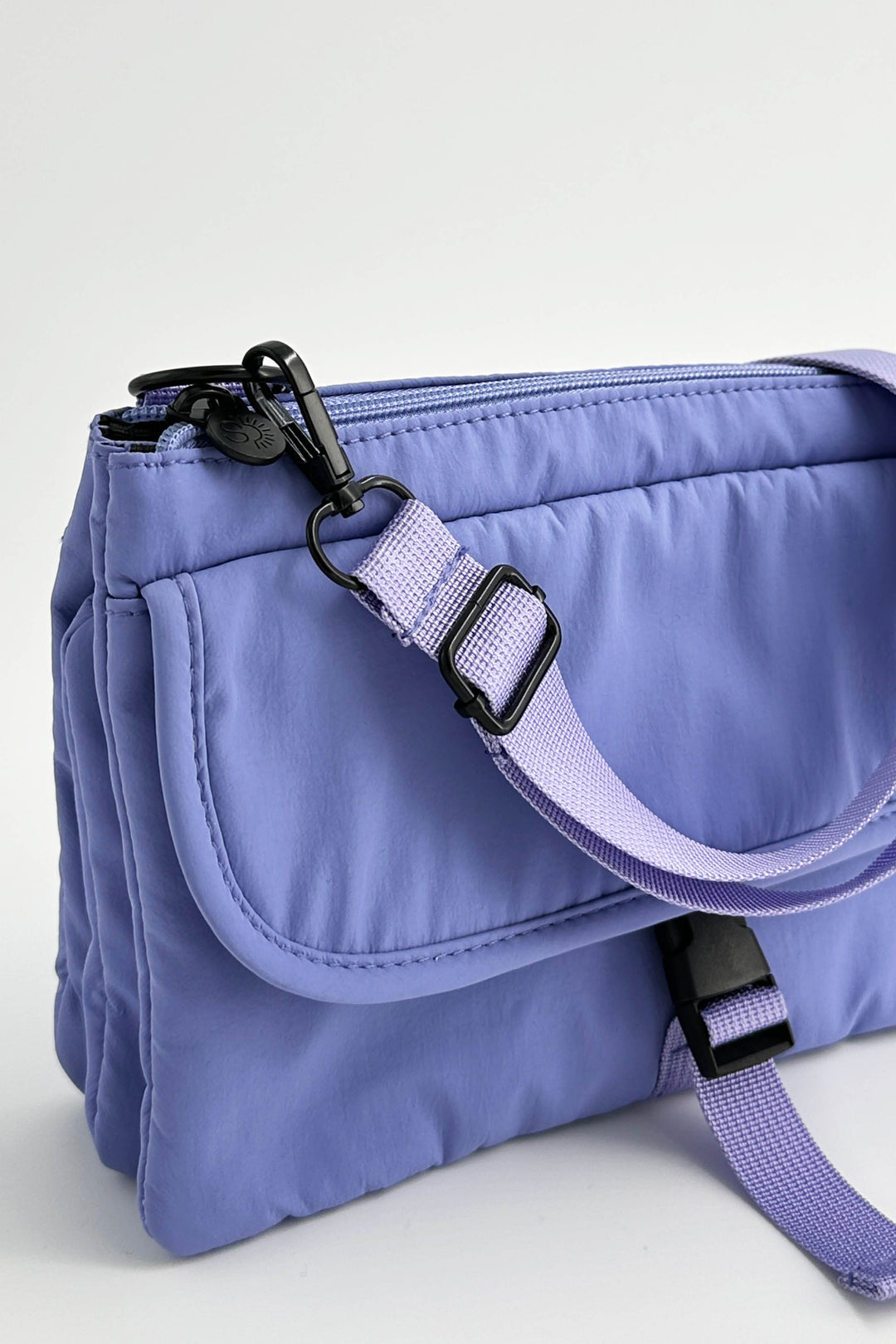 Purple bag with a strap on a white background