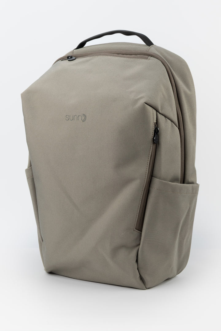 grey  laptop backpack three quarter front view with side pockets and sunri zipper pulls

