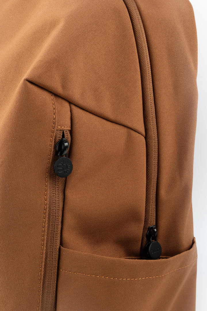 close up of ora laptop backpack zipper pullers