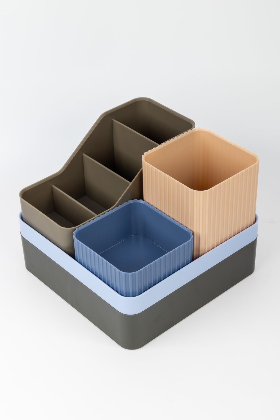 Set of multi-colored storage containers on a white background