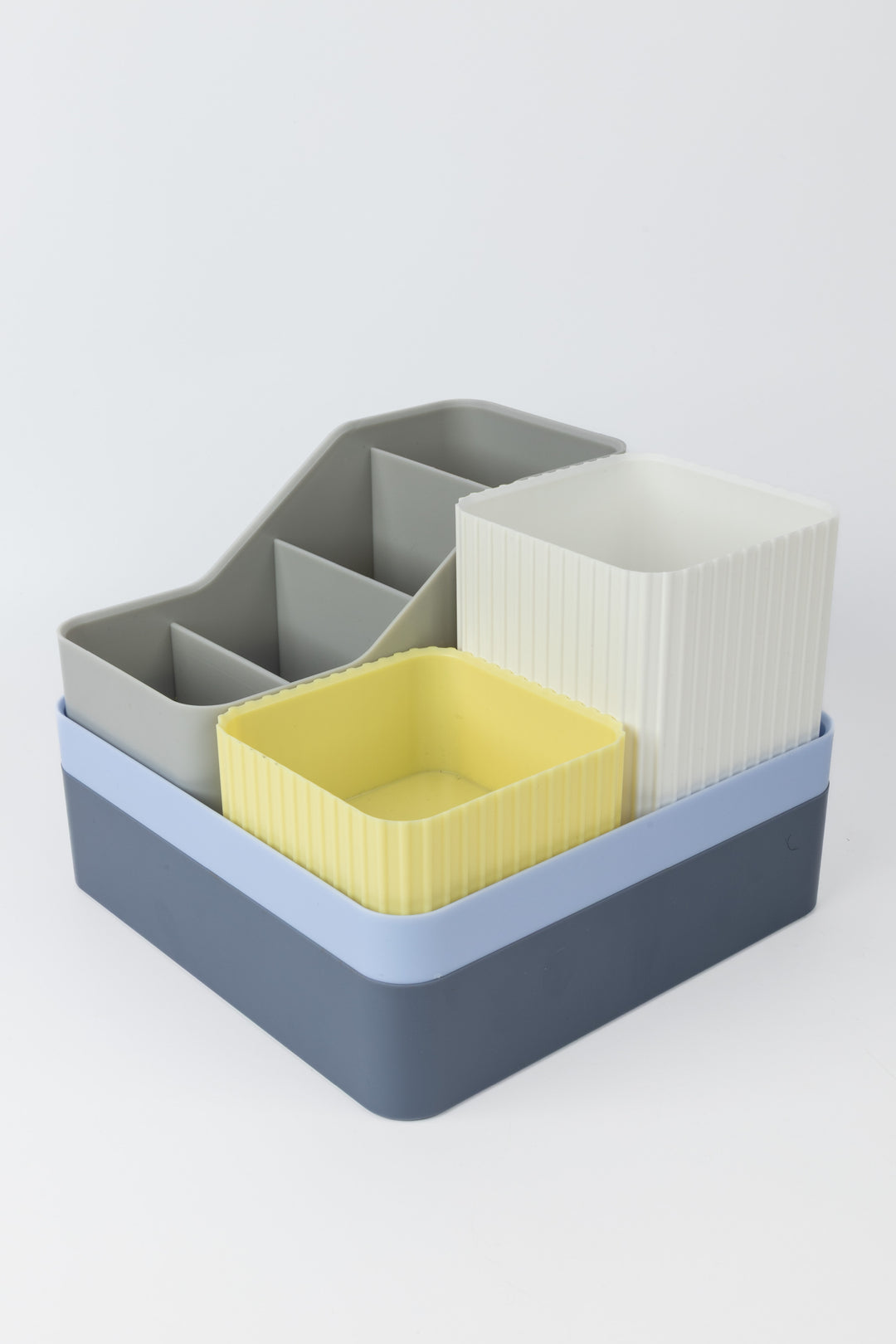 Multicoloured organiser with compartments on a white background