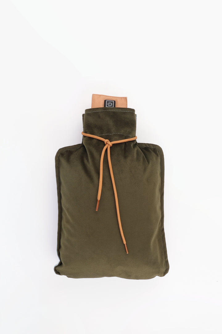 Green hot water bottle with strap on a white background