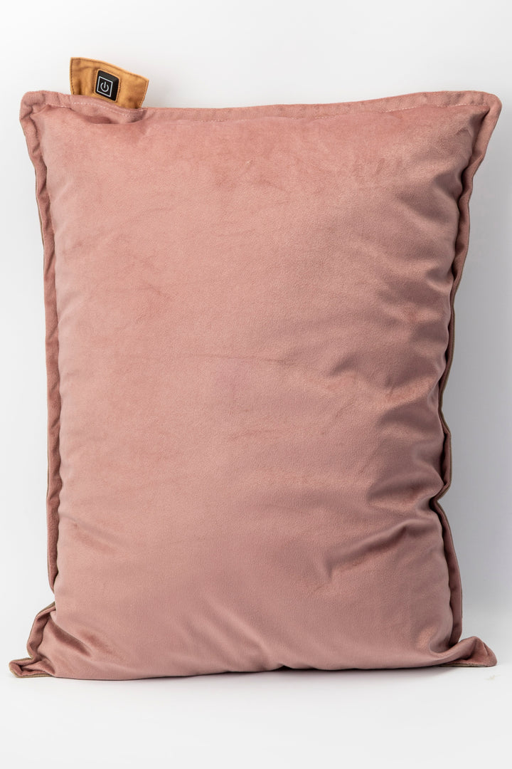 Pink pillow with a brand tag on a white background