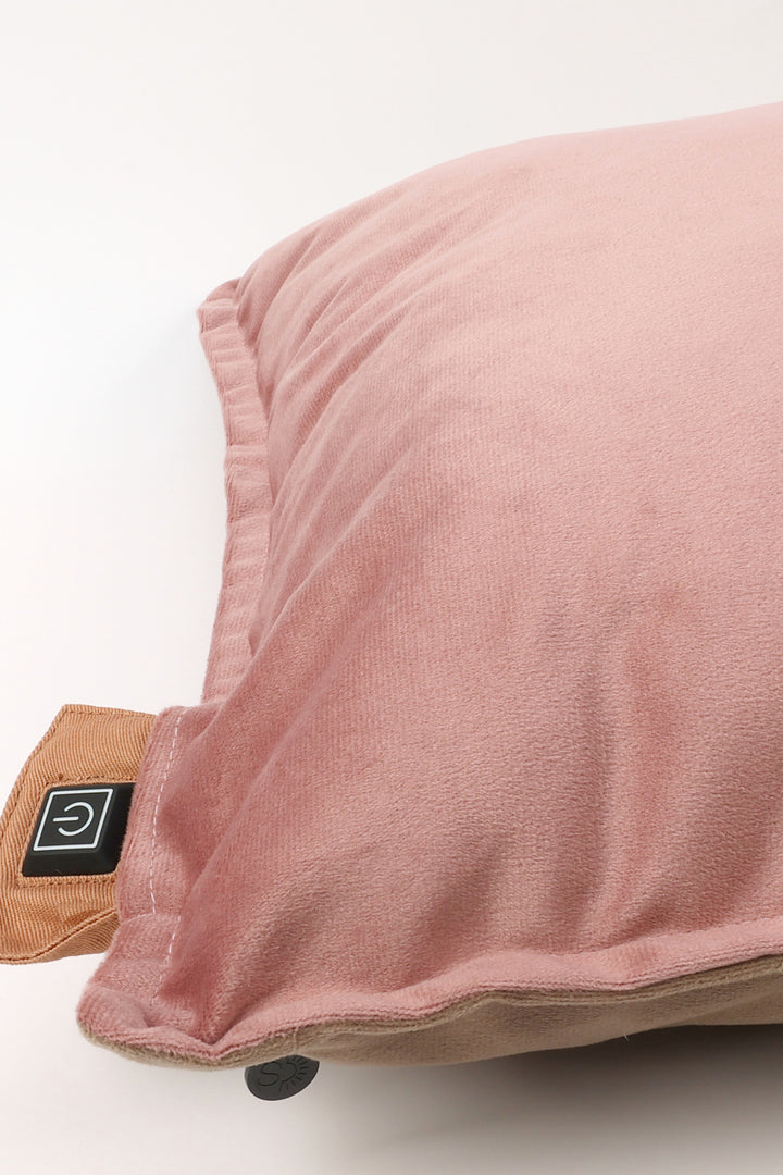 Pink pillow with a brown base on a white background