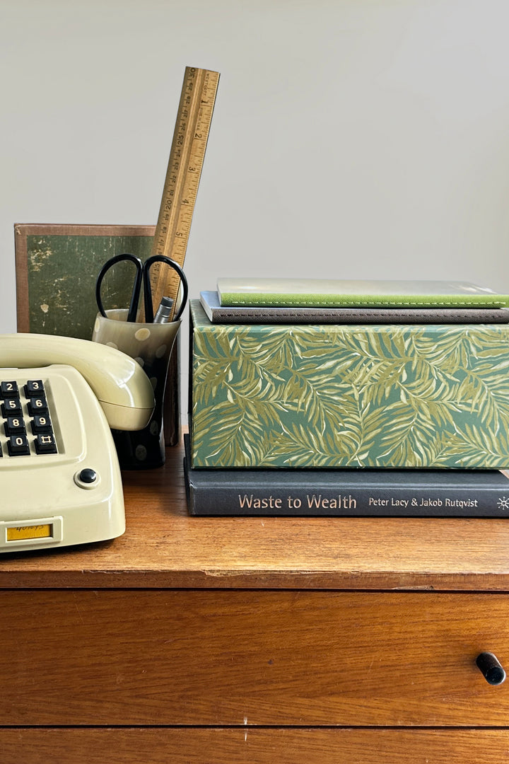 Foldable modular desk organiser A5 palms box styled on desk with books