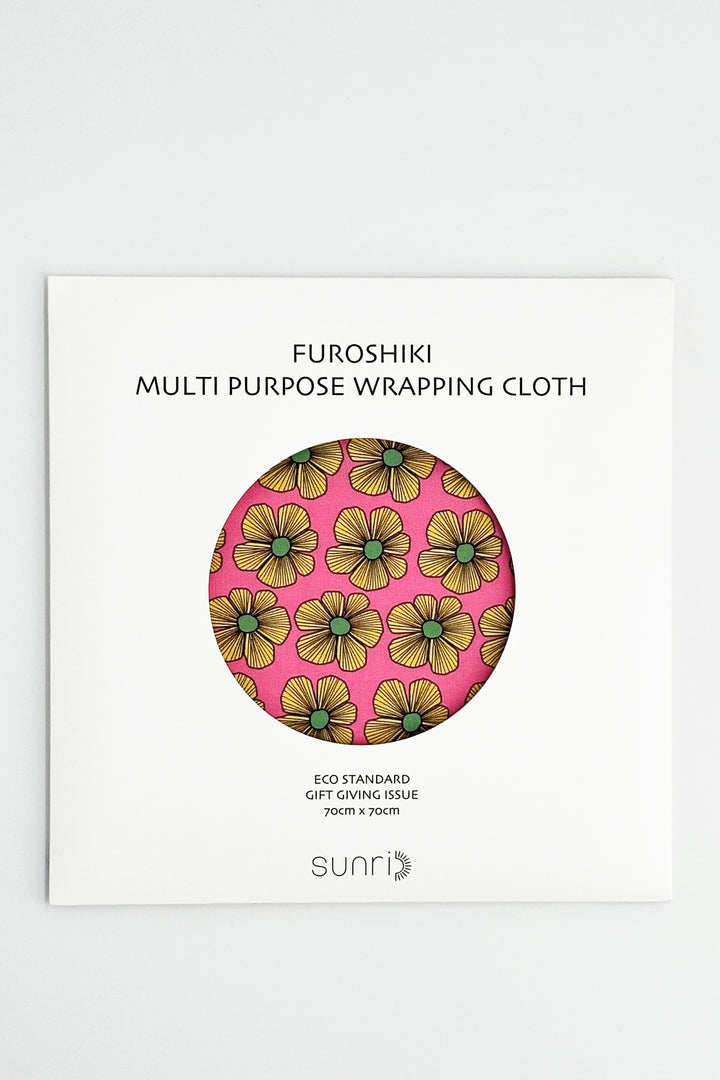 furoshiki wrapping cloth packaging with pink floral print and circular fabric sample