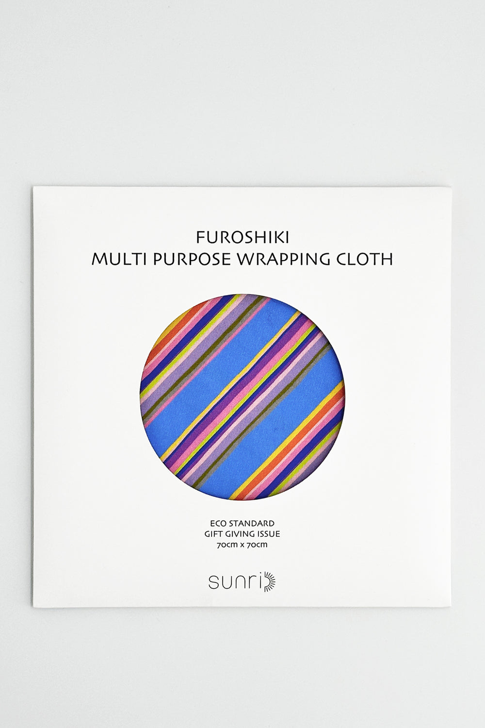 furoshiki wrapping cloth folded flat with blue base and multicolour diagonal stripes