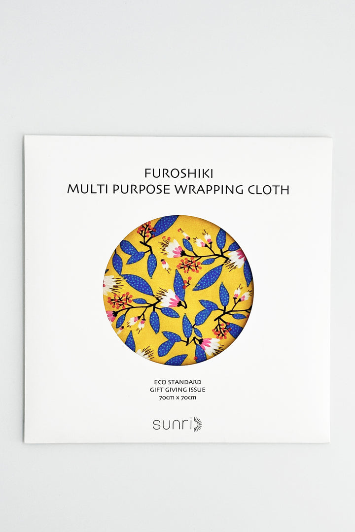 furoshiki wrapping cloth packaging with yellow floral print and circular fabric sample