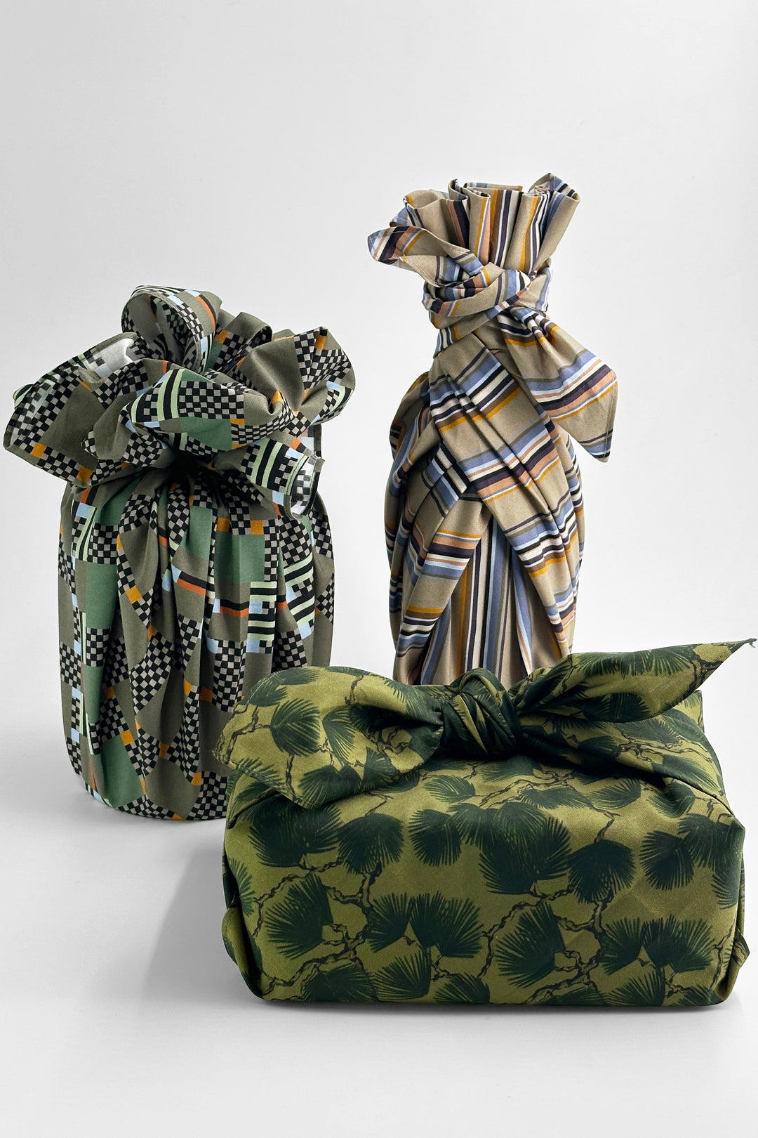 furoshiki wrapping cloth tied around gifts using geometric check and striped fabrics