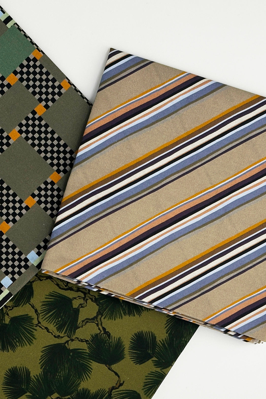 layered furoshiki wrapping cloth with striped fabric and green botanical print
