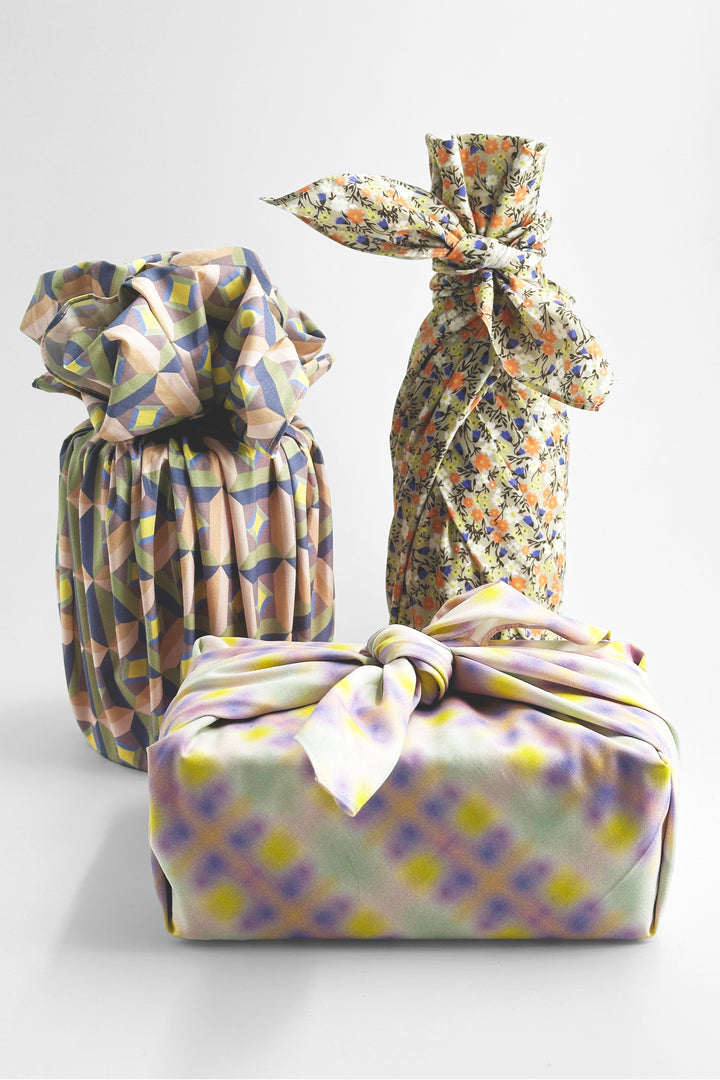 furoshiki wrapping cloth tied around gifts with all over floral pattern