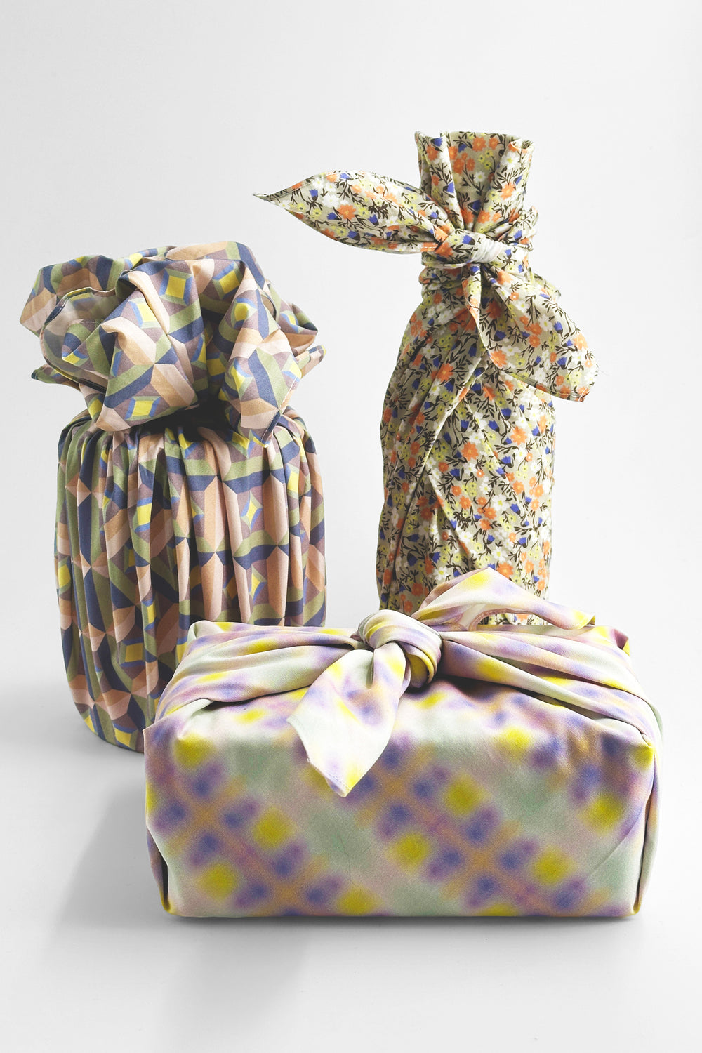 Furoshiki wrapping cloth with optic print used to wrap gifts in different shapes
