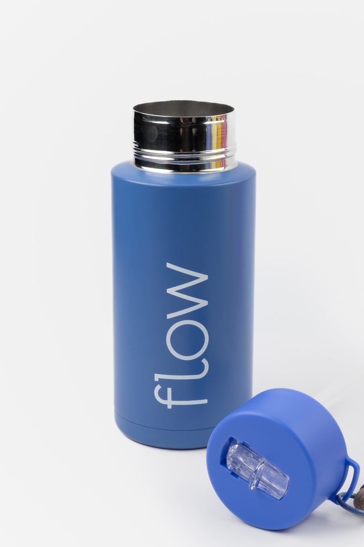 blue insulated flow bottle with lid removed showing wide opening