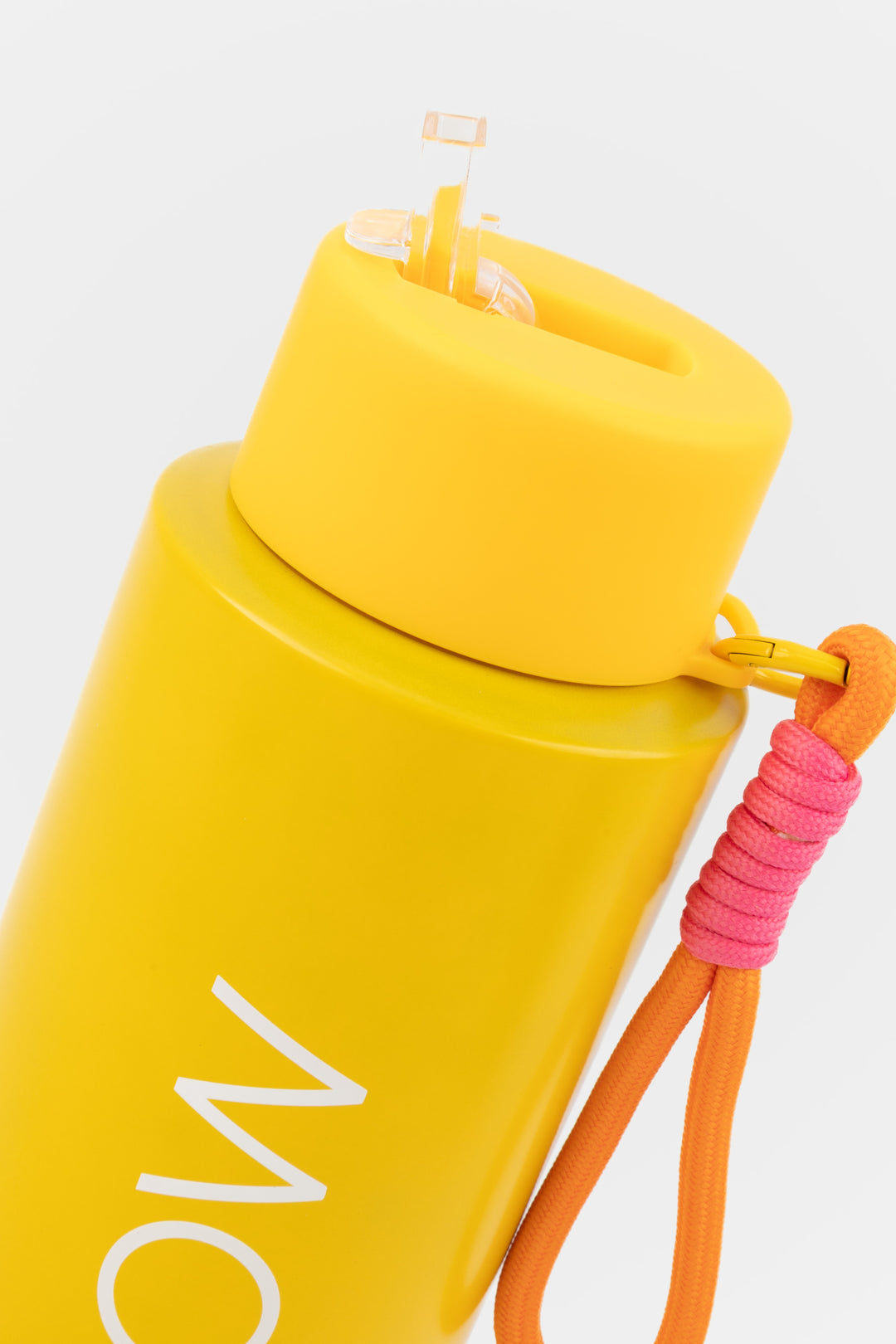 close up of flip mouthpiece on deep yellow insulated flow bottle
