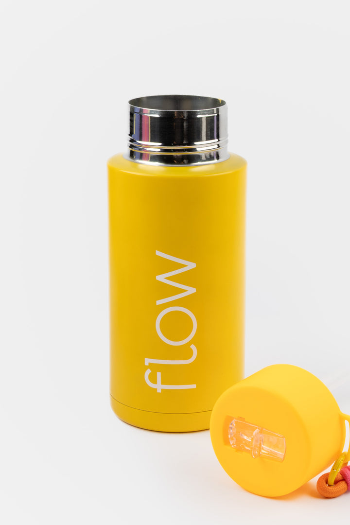 deep yellow insulated flow bottle with lid removed showing wide opening