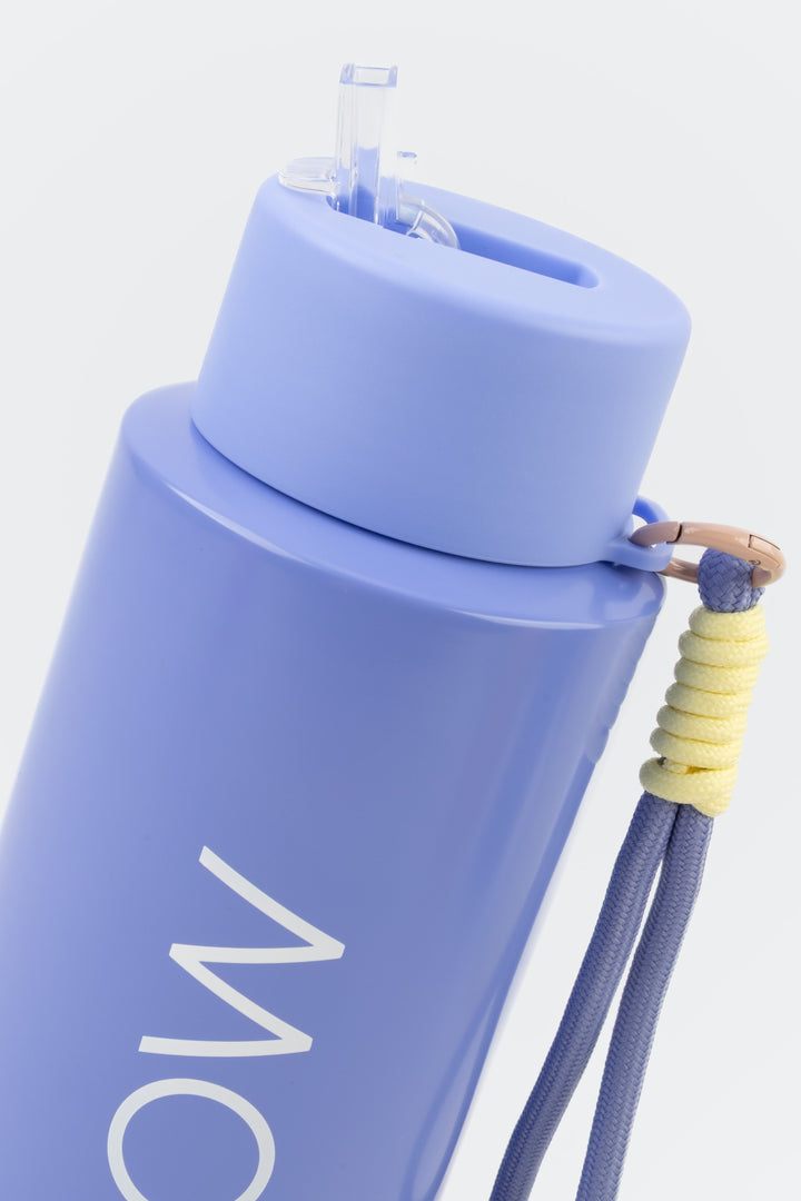 close up of flip mouthpiece on purple insulated flow bottle
