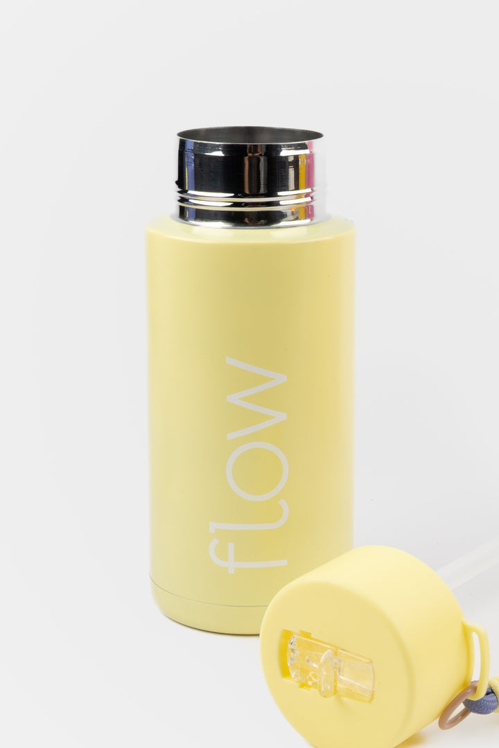 yellow insulated flow bottle with lid removed showing wide opening