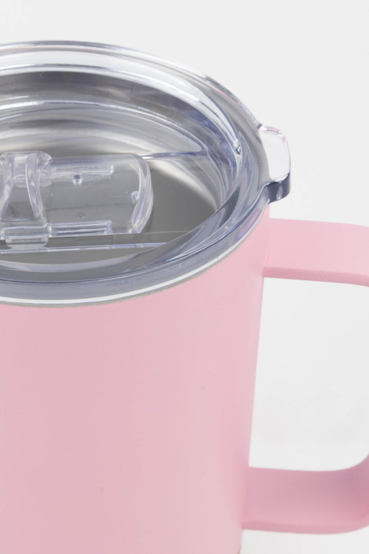 close up of clear lid and handle on pink insulated mug with cork base

