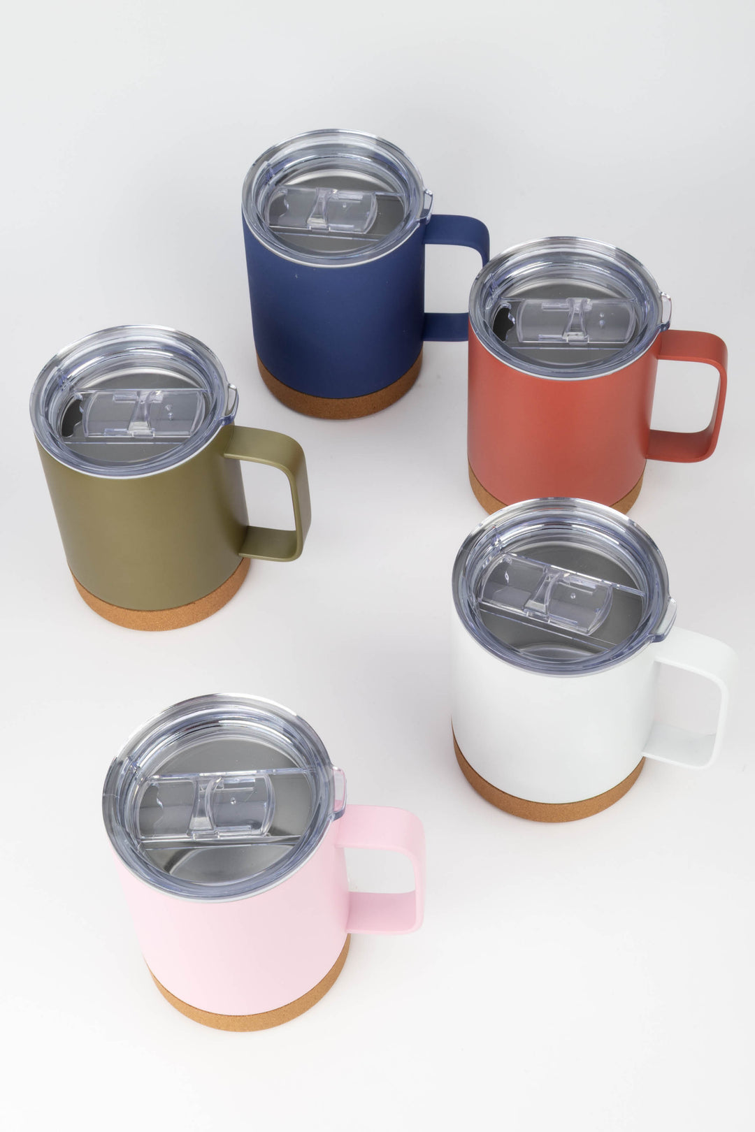 group of insulated mugs in multiple colours with clear lids and cork bases
