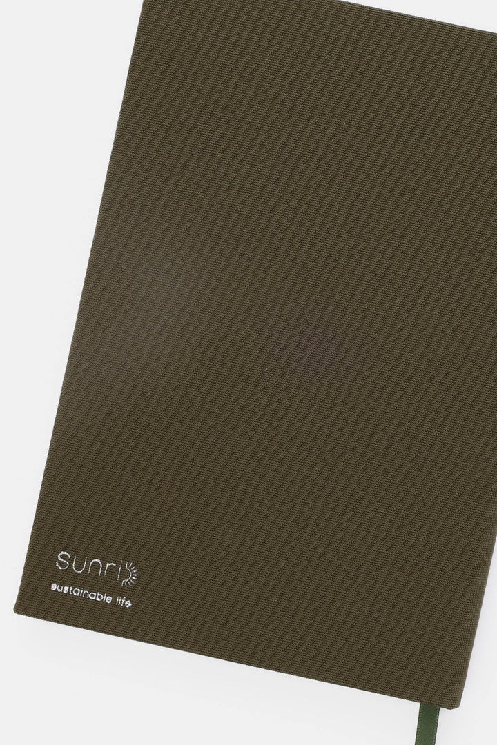 backside of notebook with 'sunri' logo 