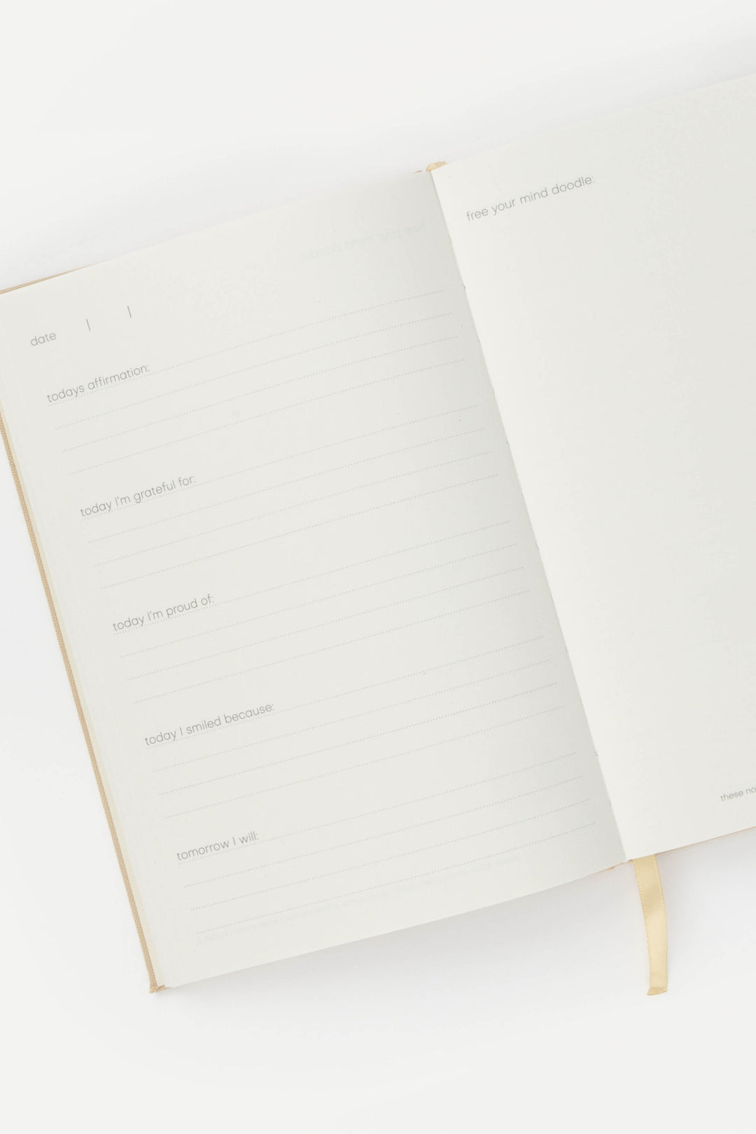 A5 RPET journal opened to structured prompts, with lined pages for daily reflection and a blank doodle page on the right.