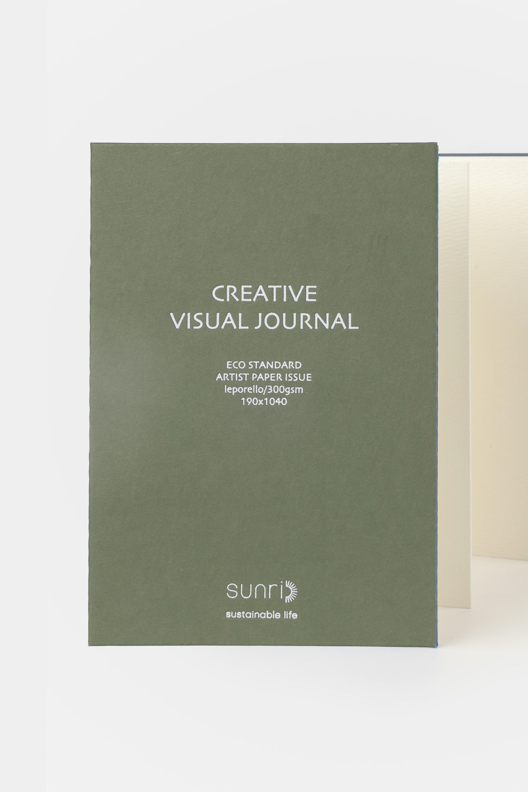 green 鈥楥reative Visual Journal鈥?with 鈥榮unri鈥?branding shown front facing with leporello pages slightly visible

