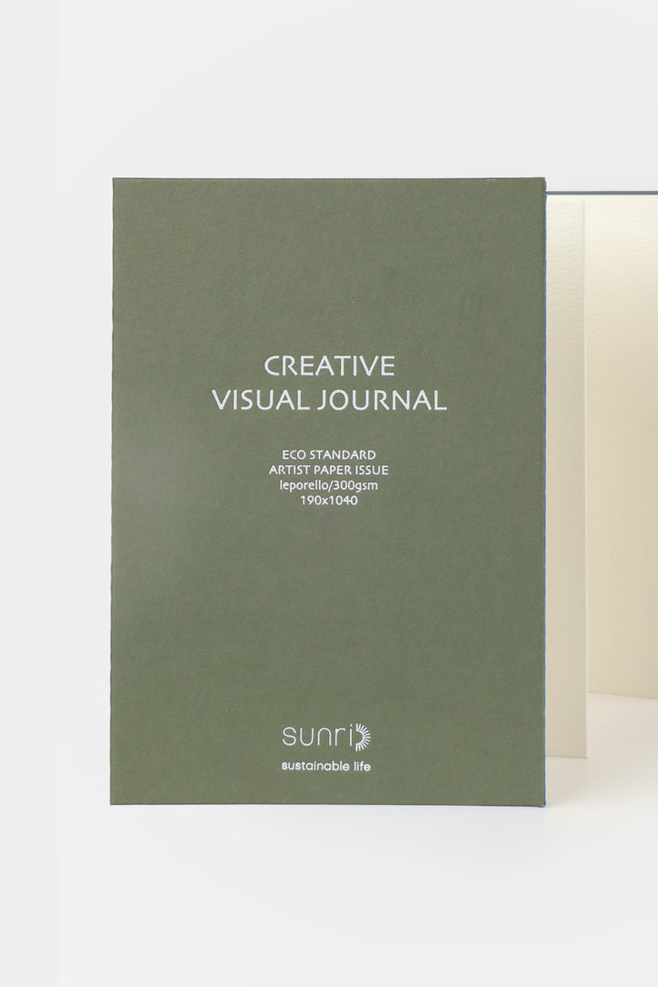 green 鈥楥reative Visual Journal鈥?with 鈥榮unri鈥?branding shown front facing with leporello pages slightly visible
