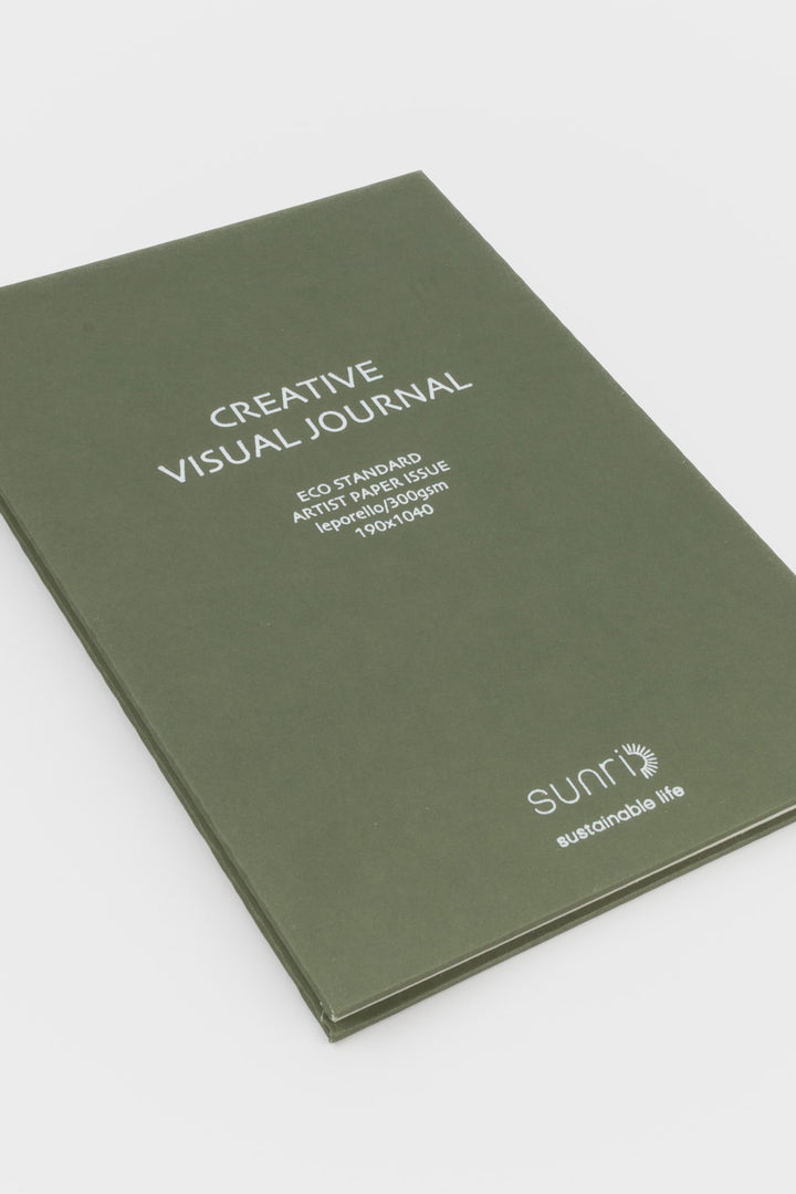green 鈥楥reative Visual Journal鈥?with 鈥榮unri鈥?branding shown closed at an angle highlighting slim hardcover profile

