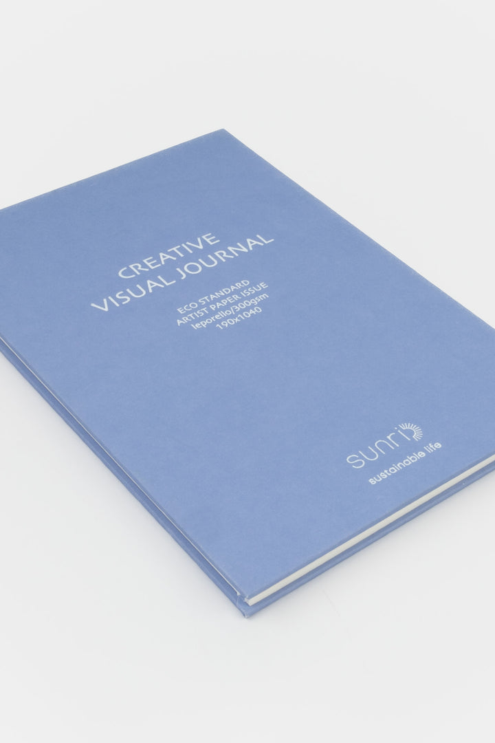 purple 鈥楥reative Visual Journal鈥?with 鈥榮unri鈥?branding shown closed at an angle highlighting slim hardcover profile
