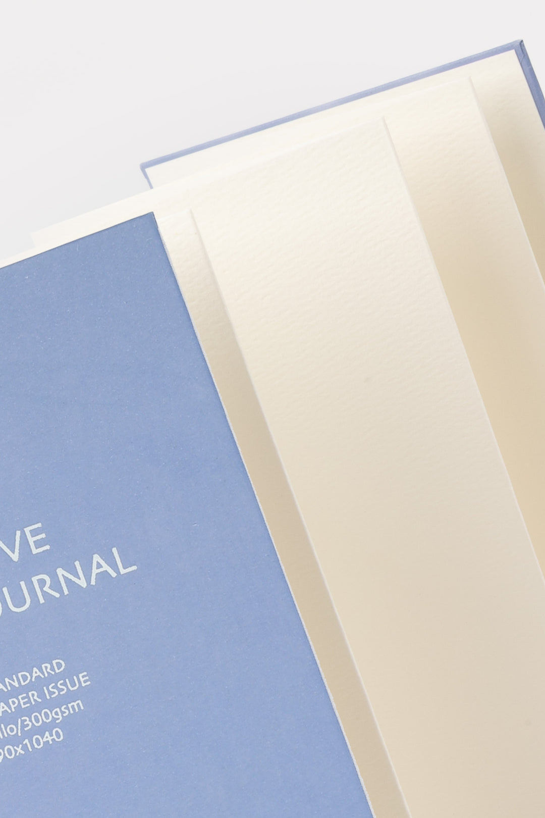 Close view of leporello folded sketch pages inside the purple 鈥楥reative Visual Journal鈥?with 鈥榮unri鈥?branding
