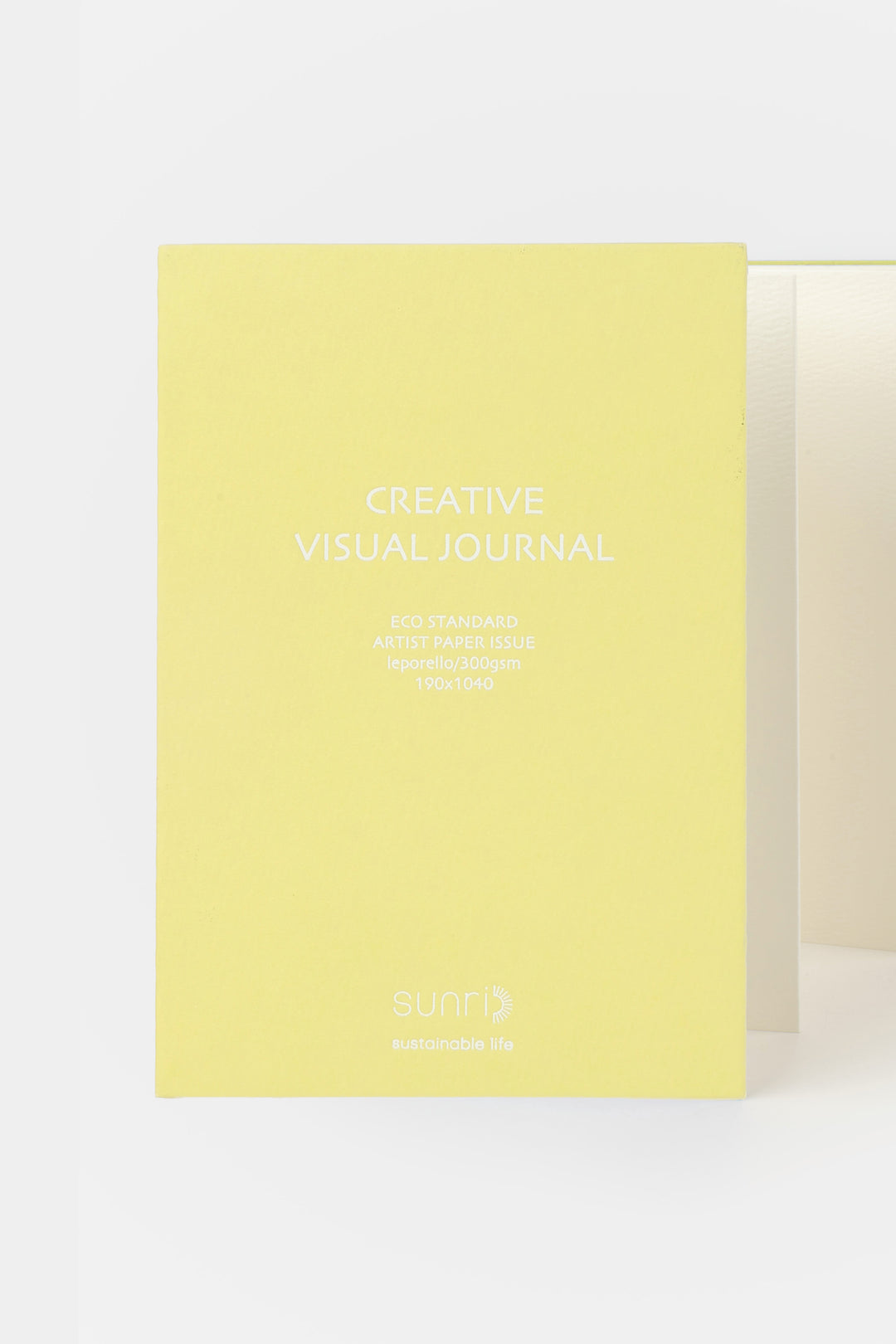 yellow 鈥楥reative Visual Journal鈥?with 鈥榮unri鈥?branding shown front facing with leporello pages slightly visible
