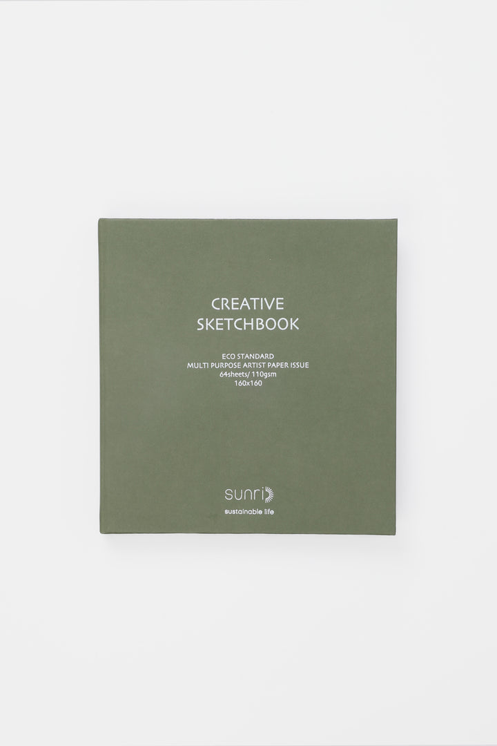 Green sketchbook with 'Creative Sketchbook' text on a white background