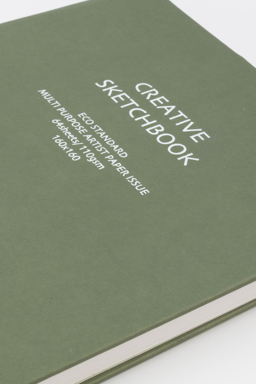 Green sketchbook with white text on a white background