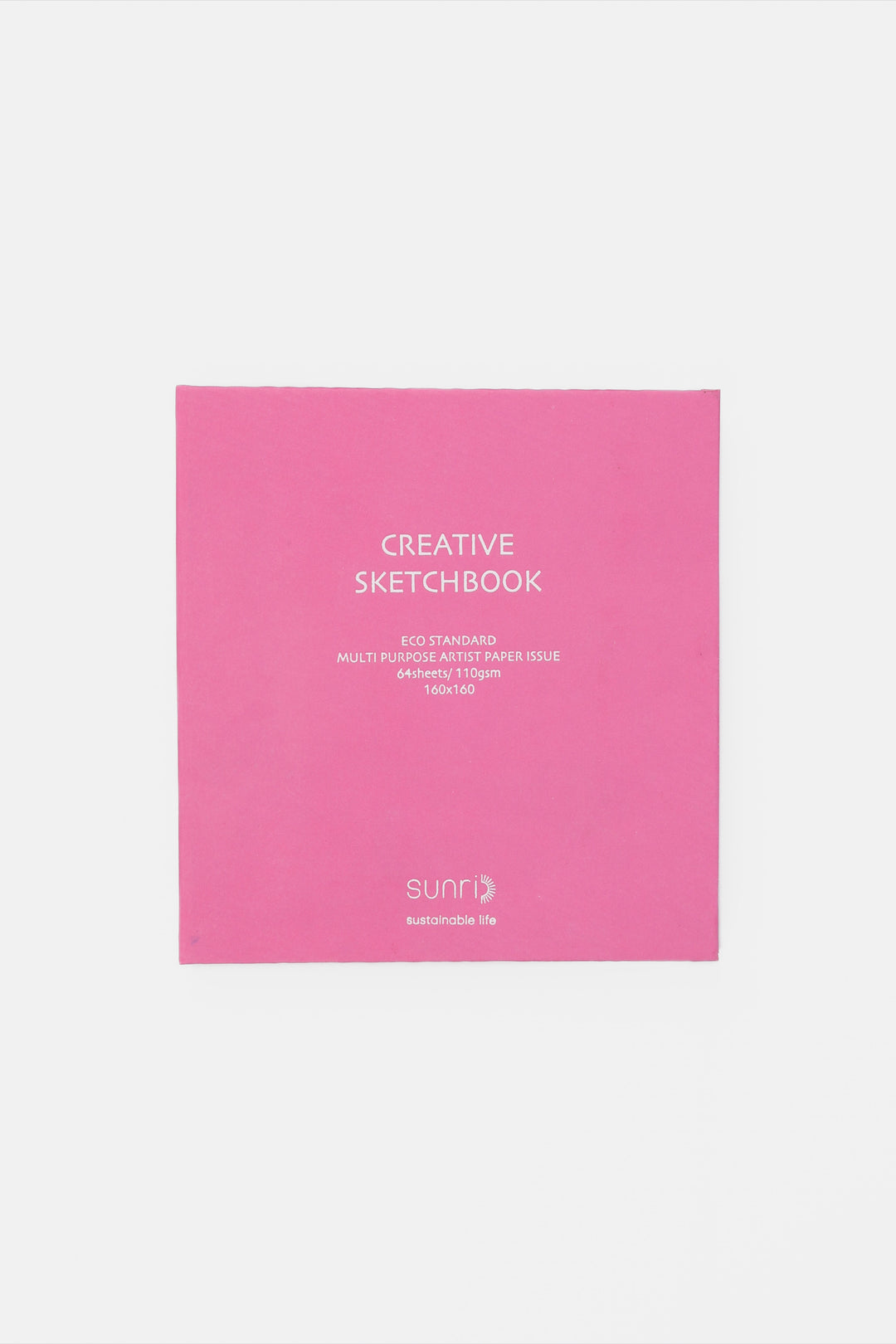 Pink sketchbook with 'Creative Sketchbook' text on a light gray background
