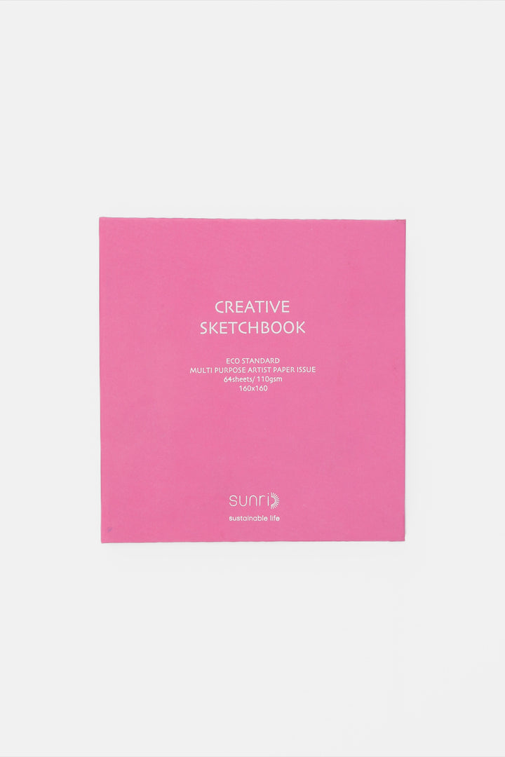 Pink sketchbook with 'Creative Sketchbook' text on a light gray background
