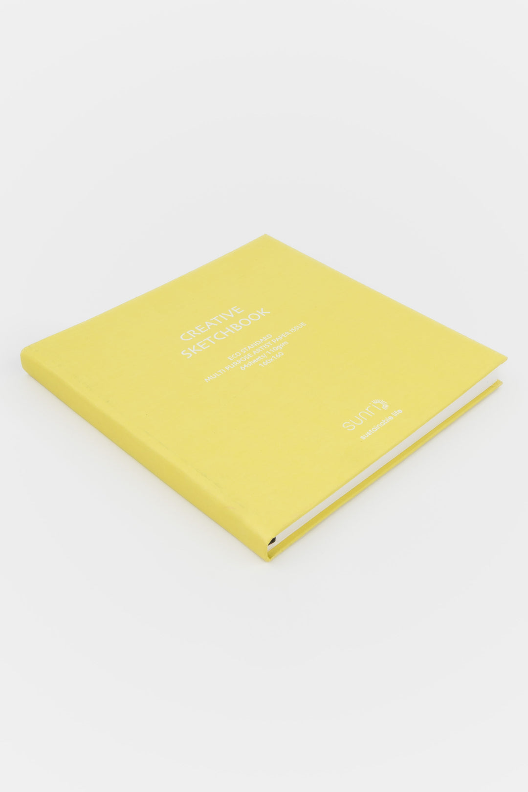 Yellow square Creative Sketchbook with white 鈥榮unri鈥?branding photographed closed on a flat white surface