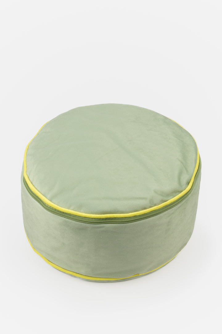 Green fabric cushion with yellow trim on a white background