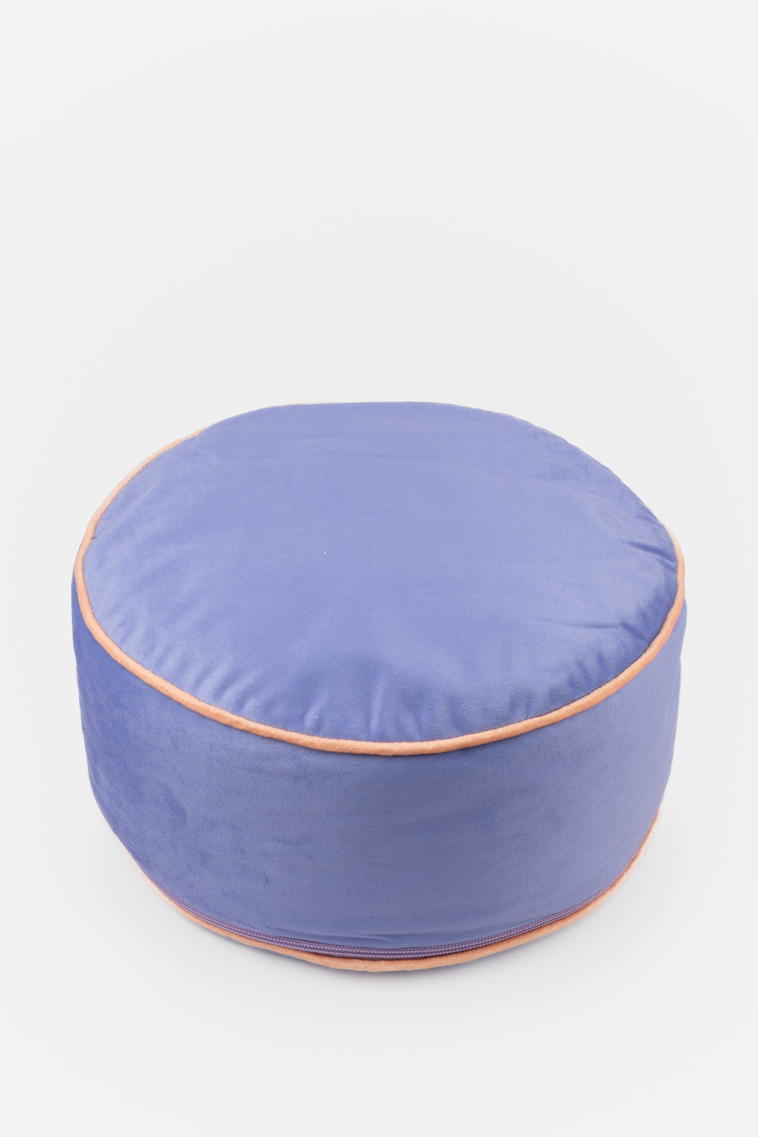 Round purple meditation pillow with a orange trim on a white background