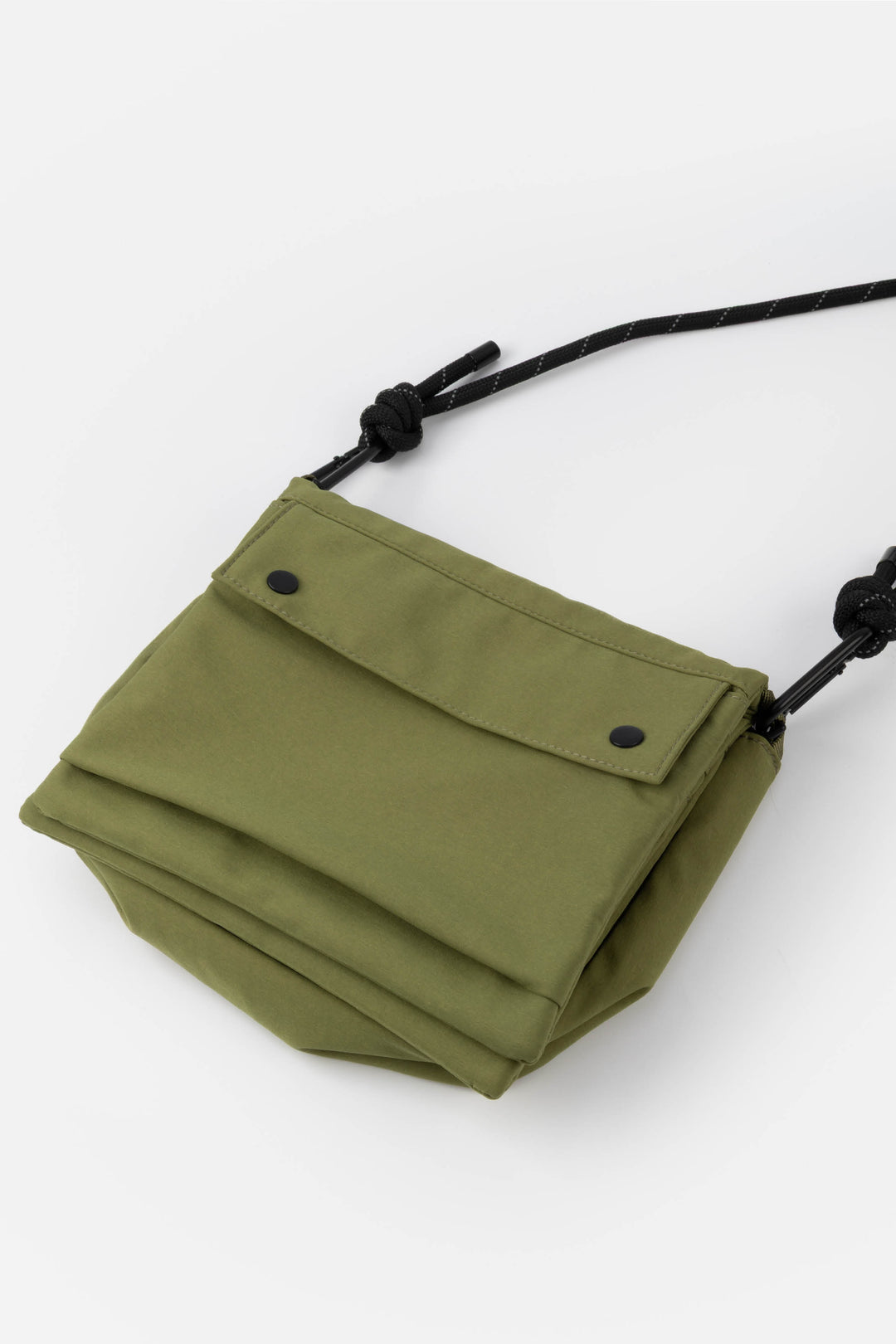 Green bag with a strap on a white background