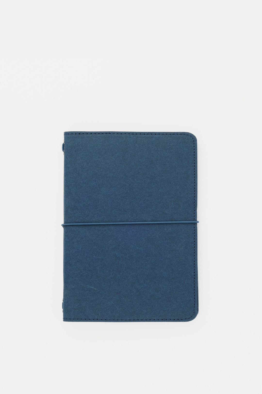Blue passport size sketch journal on a white background