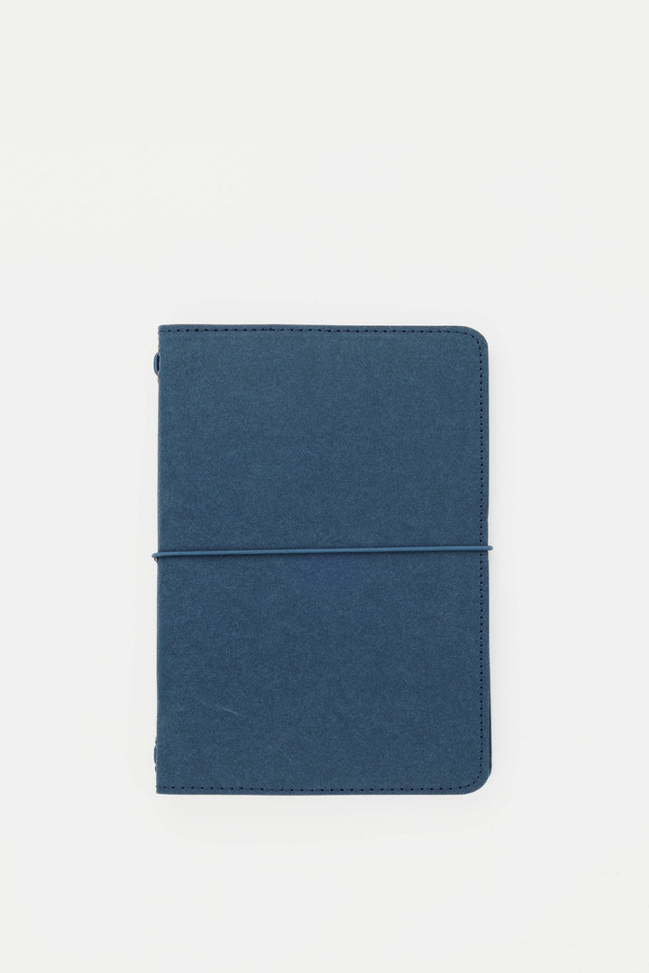 Blue passport size sketch journal on a white background