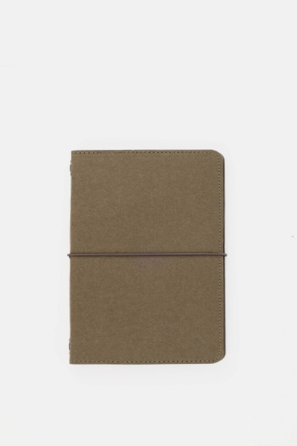 green passport size sketch journal on a white background