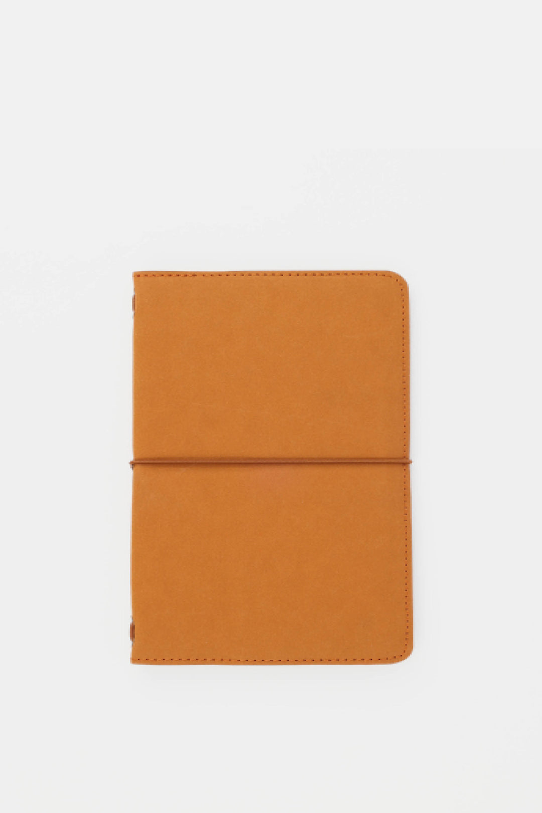 Orange passport size sketch journal on a white background